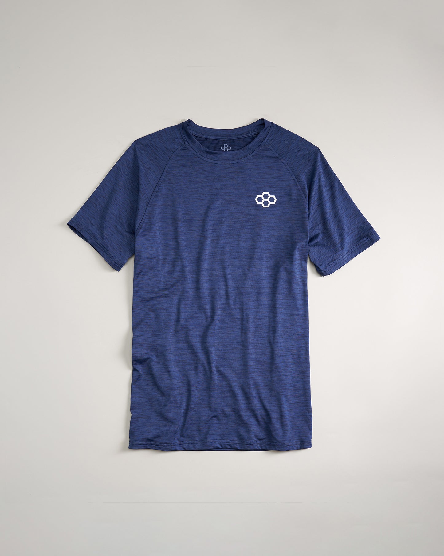 A navy blue athletic t-shirt featuring short sleeves and a small white logo embellished on the chest area displaying a smooth textured fabric pattern