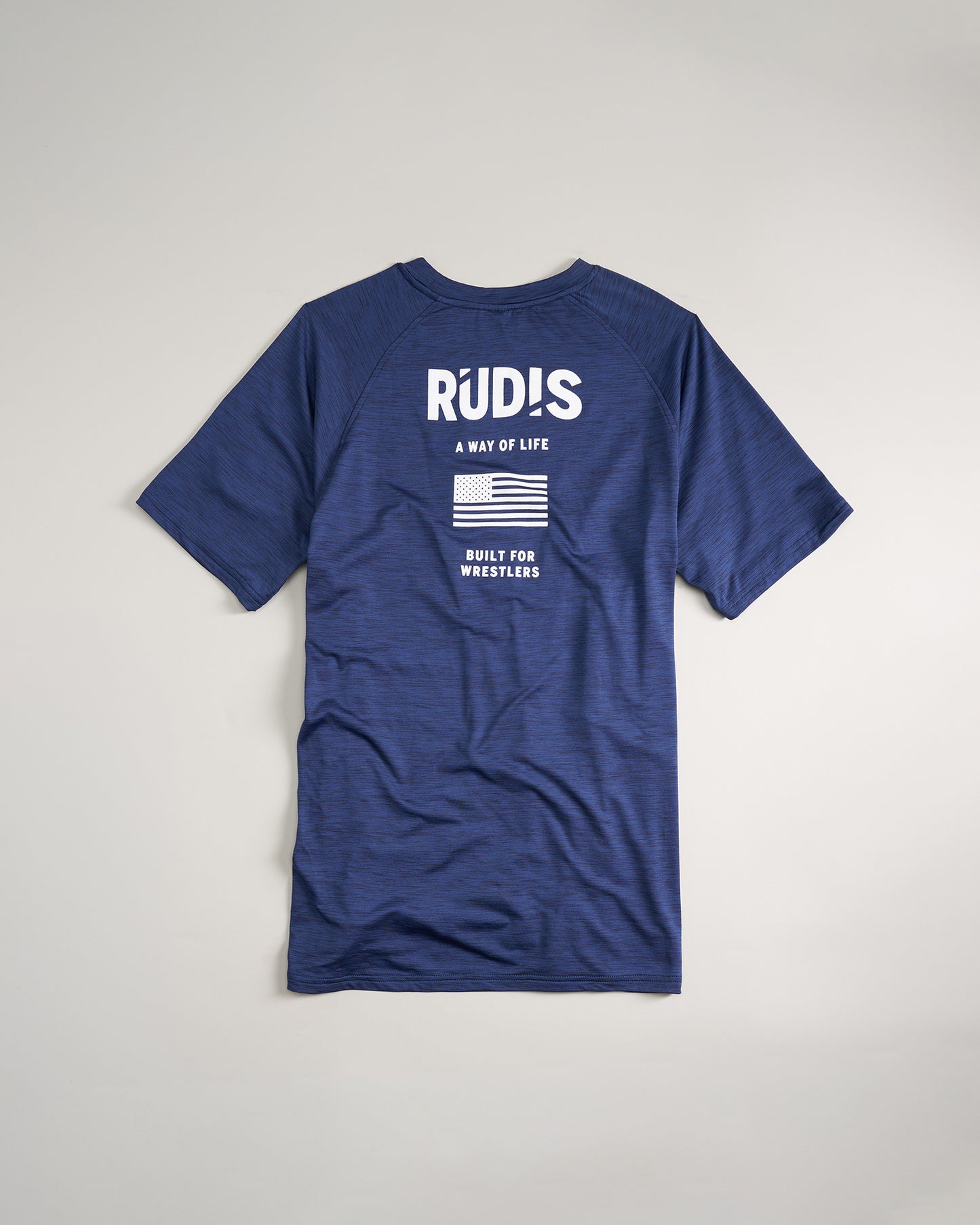 A navy blue athletic shirt featuring the text R?DÎS A WAY OF LIFE and an American flag graphic designed for wrestlers