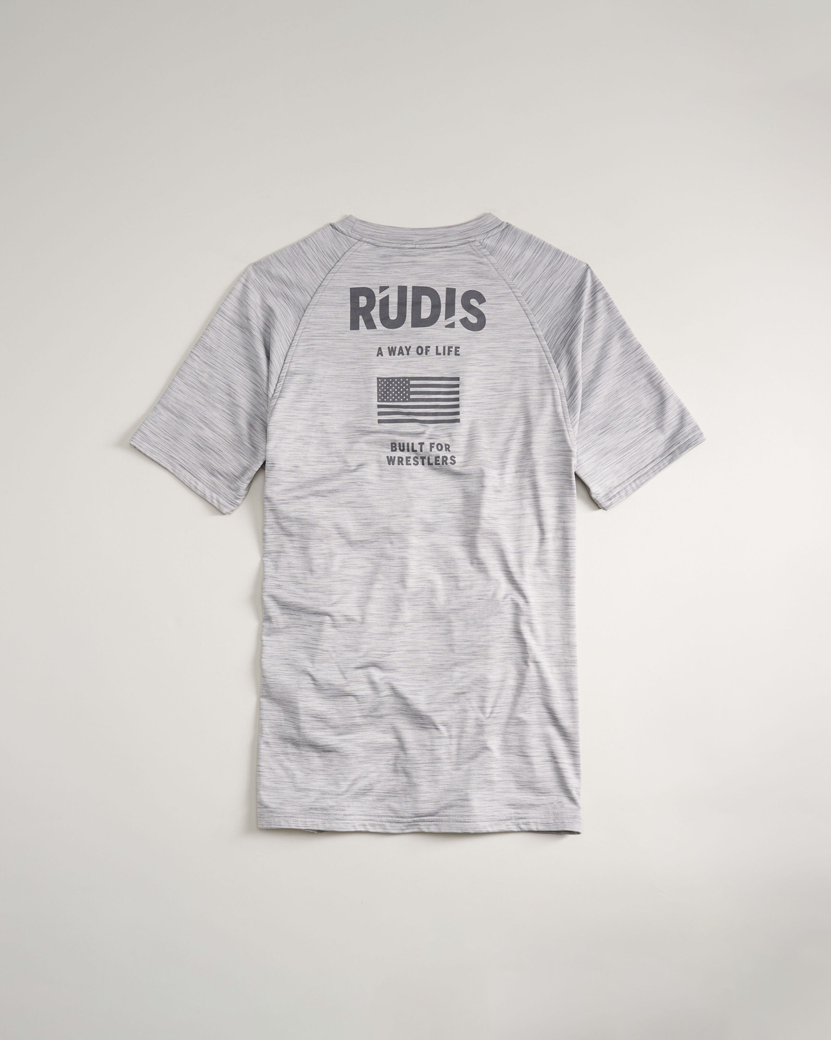 A gray athletic t-shirt featuring the text R?D!S on the back along with the phrase A WAY OF LIFE an image of the American flag and BUILT FOR WRESTLERS