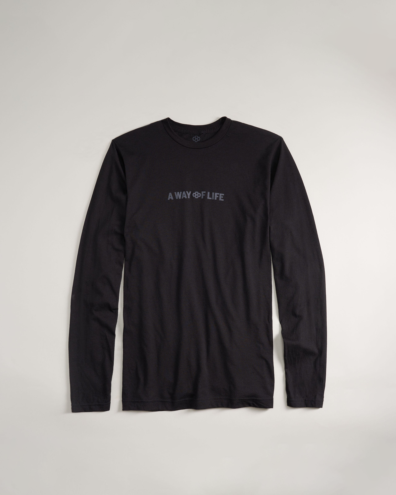 A long-sleeve black shirt featuring the phrase A WAY OF LIFE printed in a subtle design across the chest