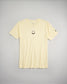 A light yellow t-shirt featuring a black smiley face design on the front and a small logo on the sleeve