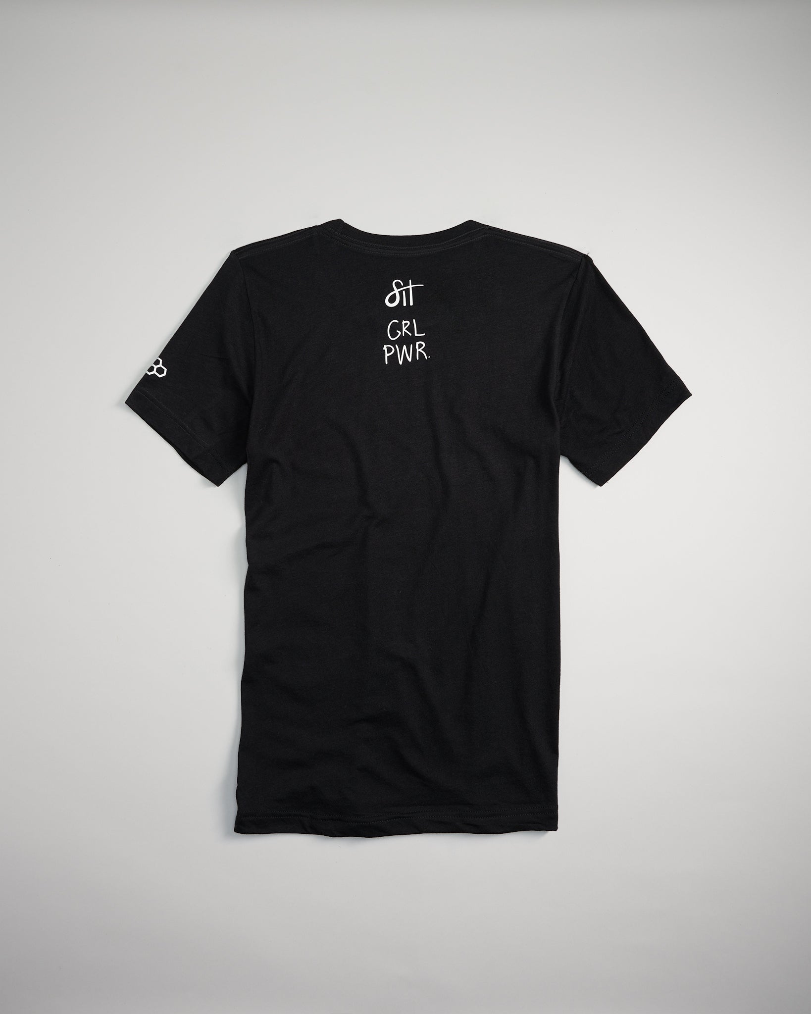 A black t-shirt featuring the phrases sit and GRL PWR elegantly displayed on the back