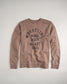 A brown sweatshirt featuring bold black lettering that states WRESTLING MIND BODY HEART SOUL complemented by a subtle brand signature at the bottom