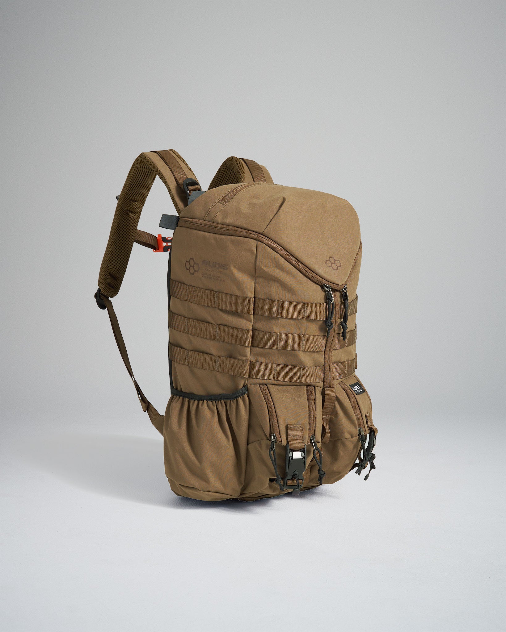 A khaki-colored tactical backpack designed for outdoor and travel use featuring multiple compartments and an adjustable strap system for comfort and utility