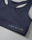 A navy sports bra with a smooth, stretchy design features 'A WAY OF LIFE' in white lettering on the band, ideal for athletic use.