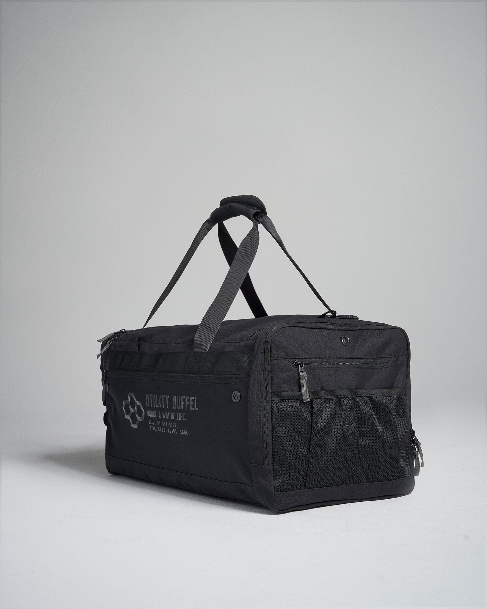 A sturdy black utility duffel bag with adjustable straps and a zippered compartment designed for practical use and versatile storage