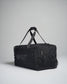 A sturdy black utility duffel bag with adjustable straps and a zippered compartment designed for practical use and versatile storage