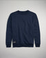 A navy blue crewneck sweatshirt featuring a subtle logo on the sleeve and a tag at the waist designed for comfort and casual wear