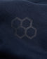 A close-up view of a dark navy fabric featuring a subtle hexagonal logo pattern highlighting its texture and design aesthetics