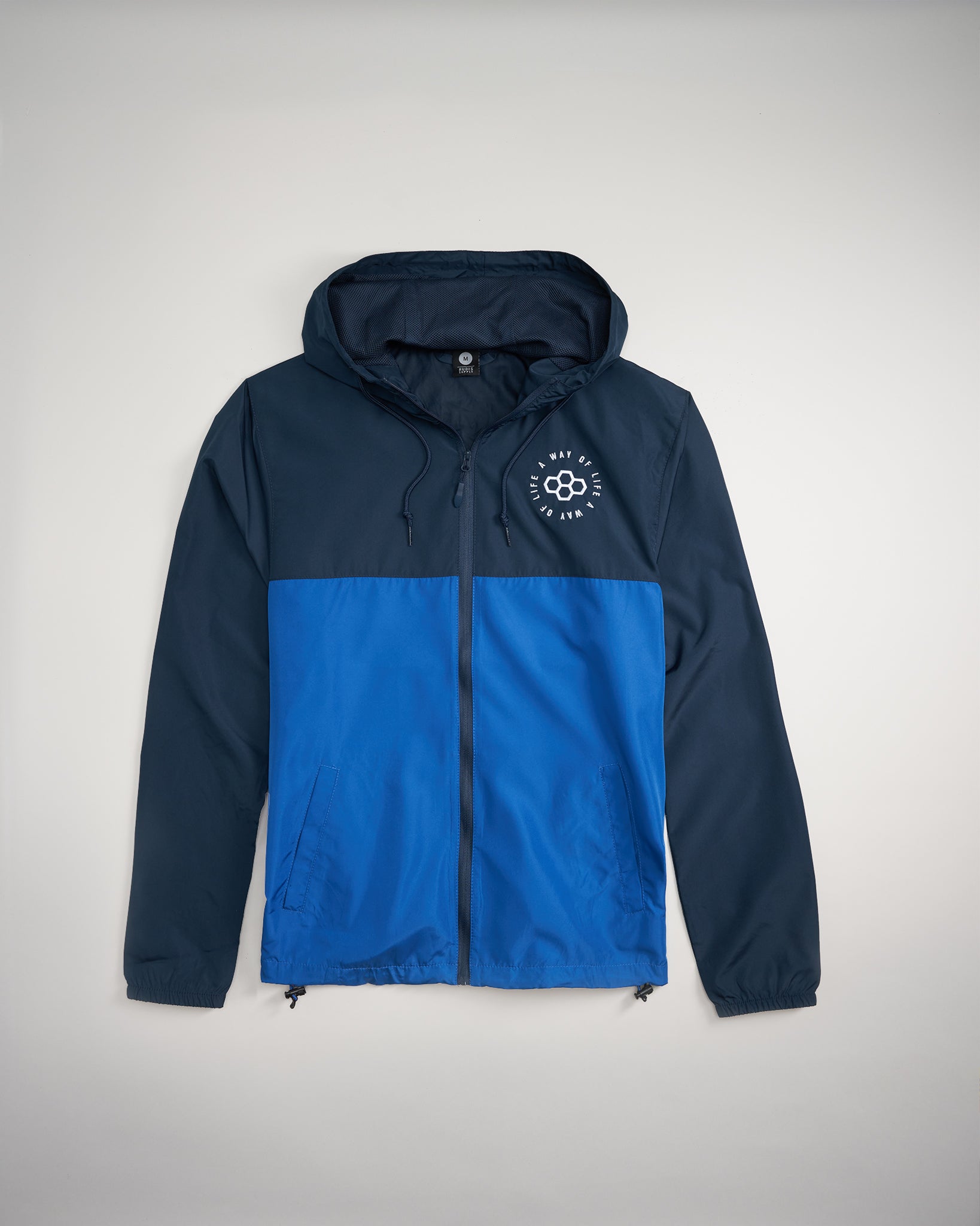 A stylish two-tone windbreaker jacket featuring navy blue and bright blue panels designed with a hood and a front zipper