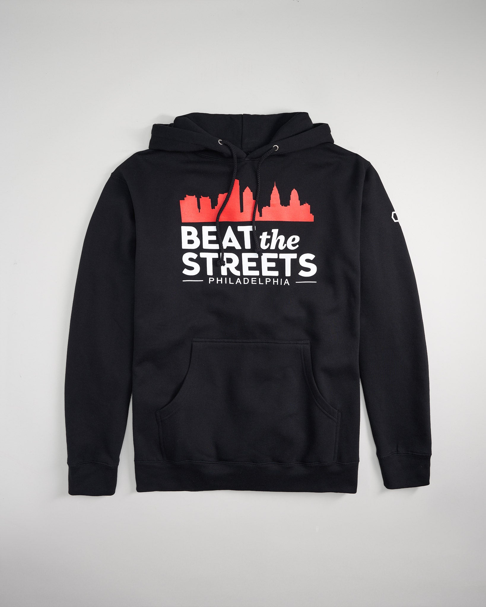 A black hoodie featuring a graphic design with the phrase BEAT the STREETS PHILADELPHIA and a skyline silhouette in red