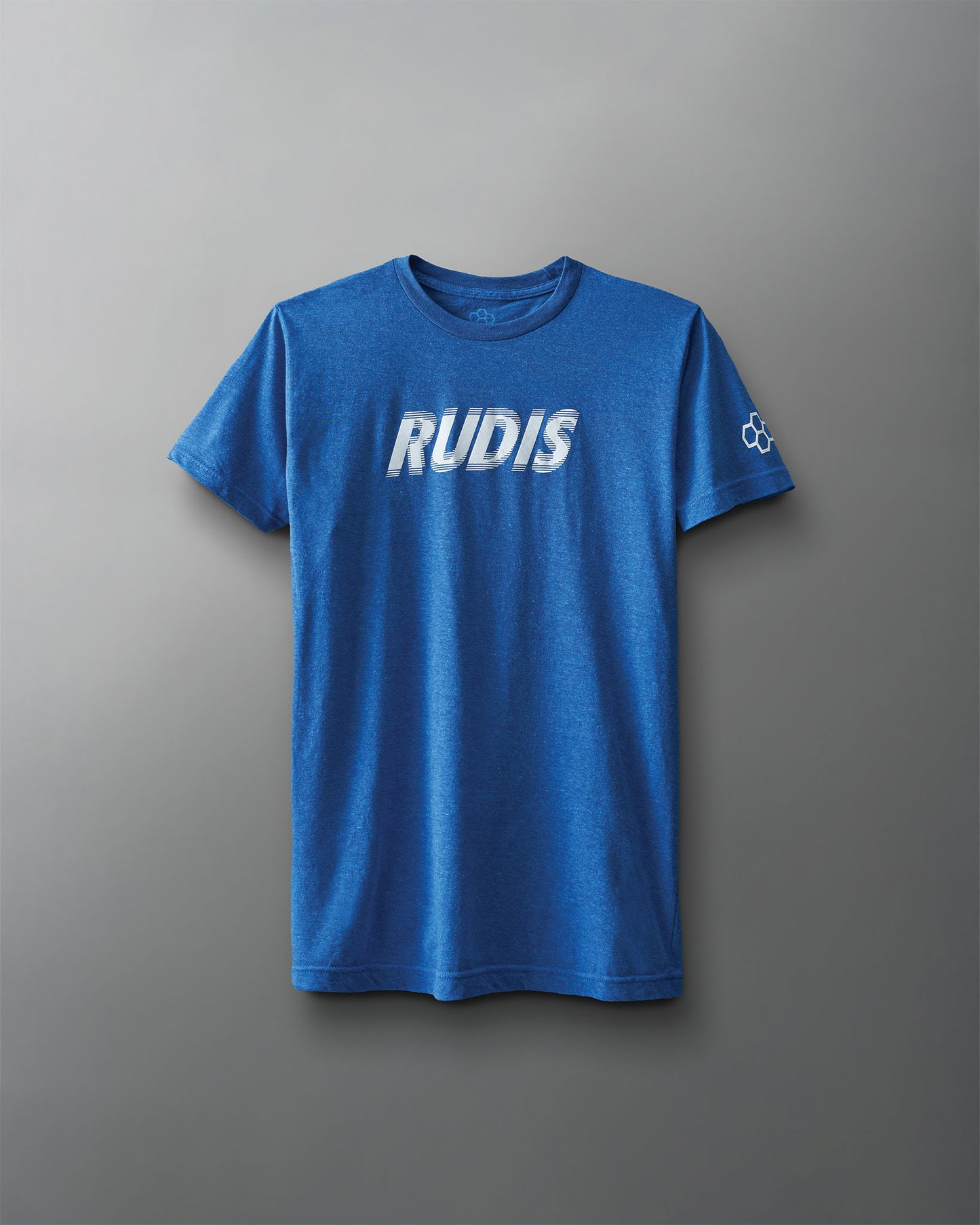 A blue T-shirt prominently displays the word 'RUDIS' in white across the chest, crafted from soft fabric against a gray background.