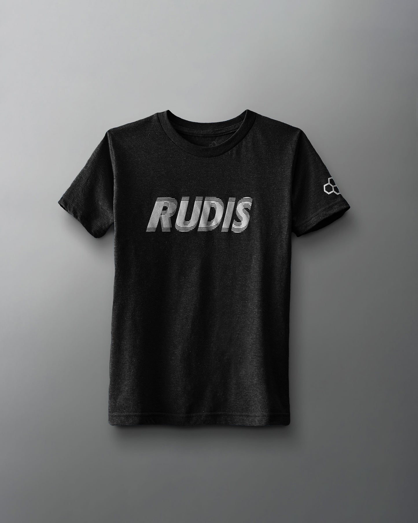 A black t-shirt features bold metallic 'RUDIS' lettering across the front and a small emblem on the sleeve, set against a gray background.