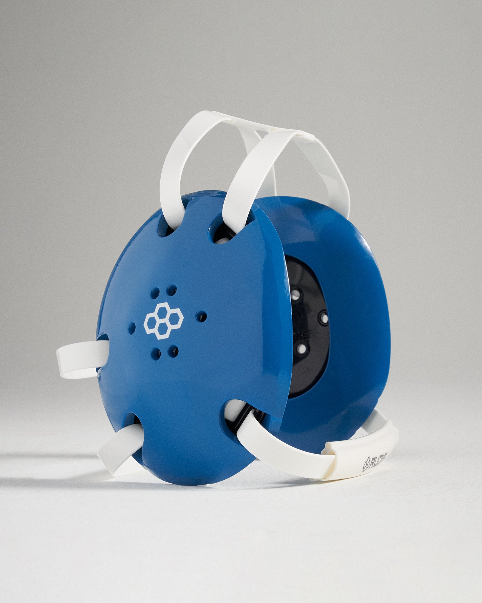 A blue safety helmet with white straps designed for protective purposes showcasing a modern aesthetic and ergonomic features