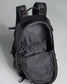 A black backpack with an open main compartment featuring a smooth inner lining and a mesh pocket