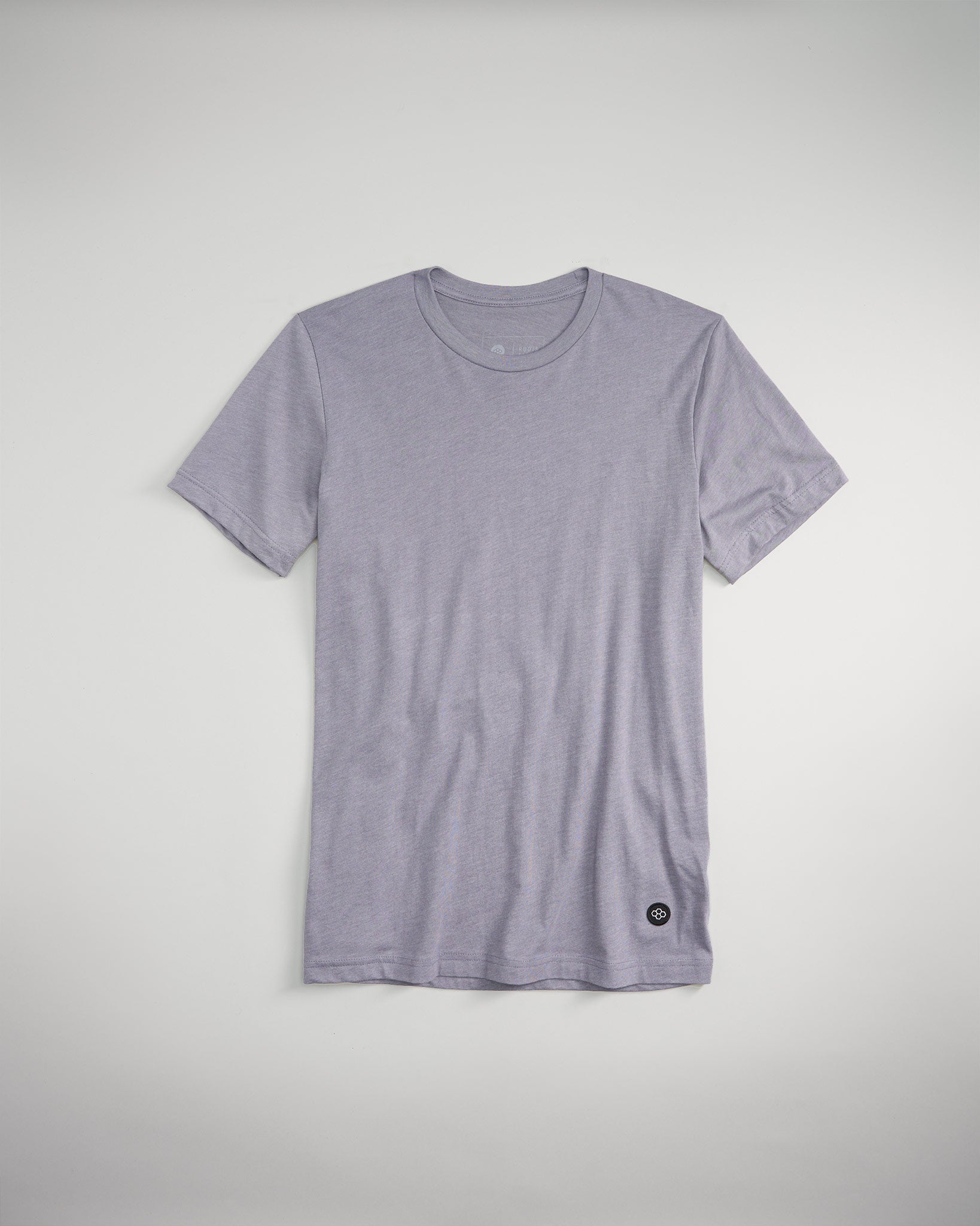 A gray T-shirt with a classic crew neckline and a small logo near the hem displayed on a light background for a clean minimalist look