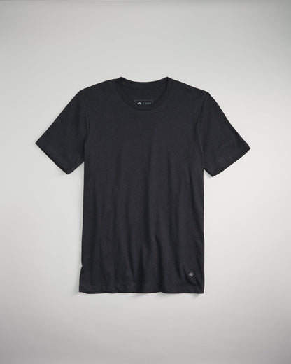 A simple and classic black t-shirt laid flat against a light background featuring a crew neckline and short sleeves ideal for casual wear