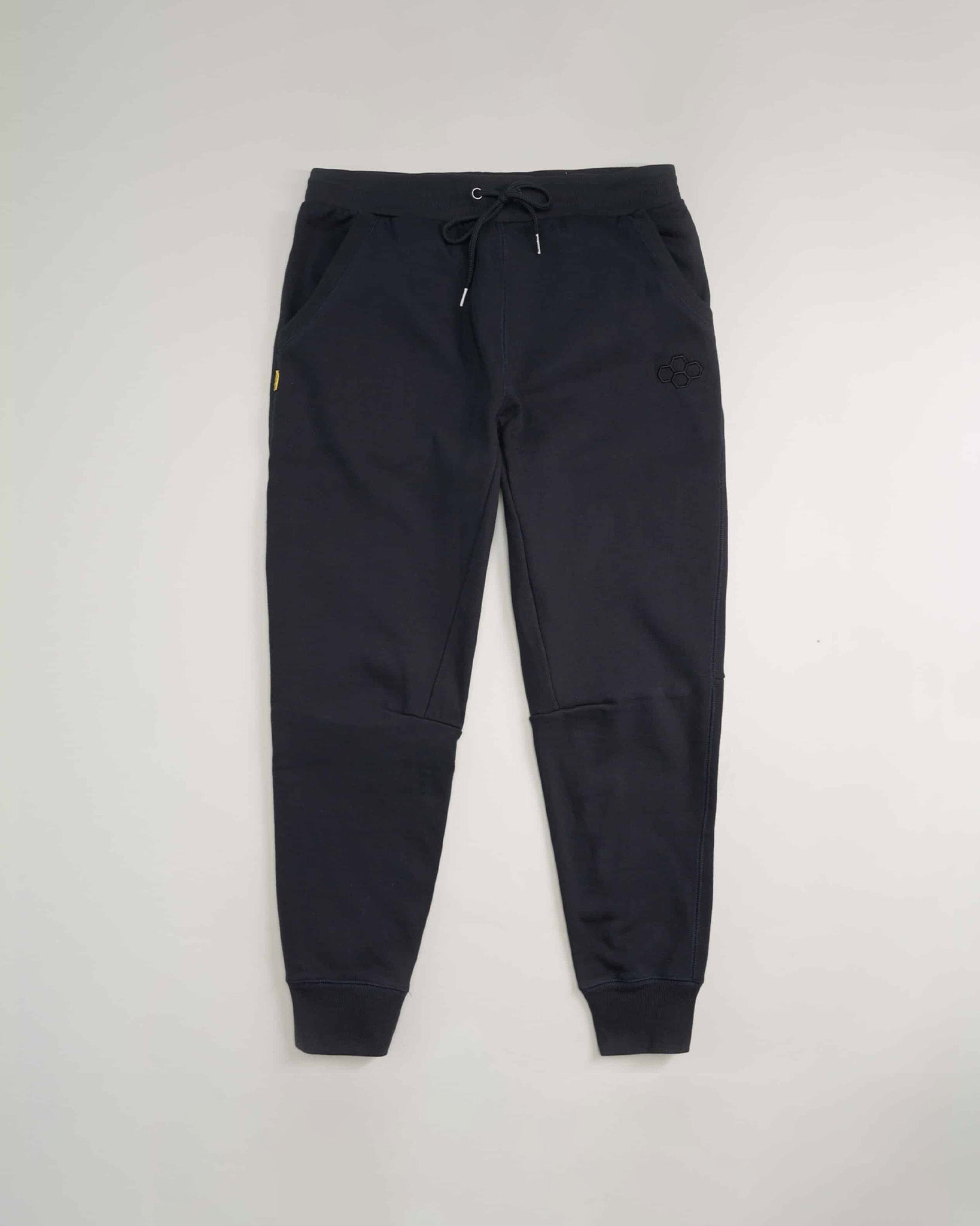 A pair of stylish black sweatpants featuring an elastic waist with drawstrings and side pockets showcasing a modern design ideal for casual wear and comfort