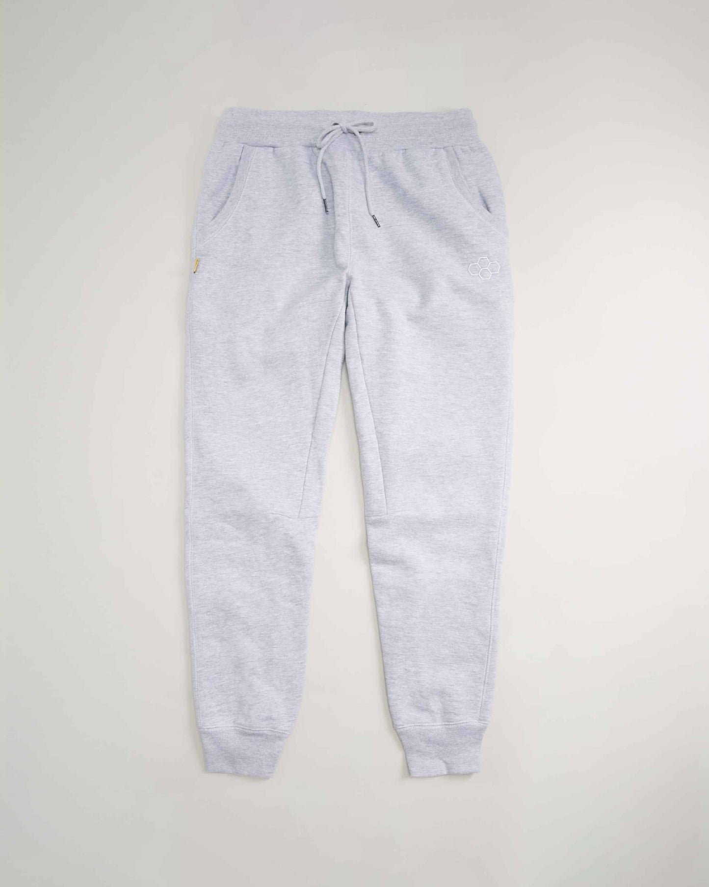 Light gray sweatpants featuring a comfortable waistband drawstring closure and side pockets ideal for casual and athletic wear