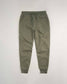 A pair of olive green jogger pants featuring a comfortable elastic waistband and subtle pocket details suitable for casual or athletic wear