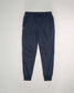 A pair of navy blue sweatpants featuring a comfortable elastic waistband drawstring and side pockets designed for casual wear and relaxation