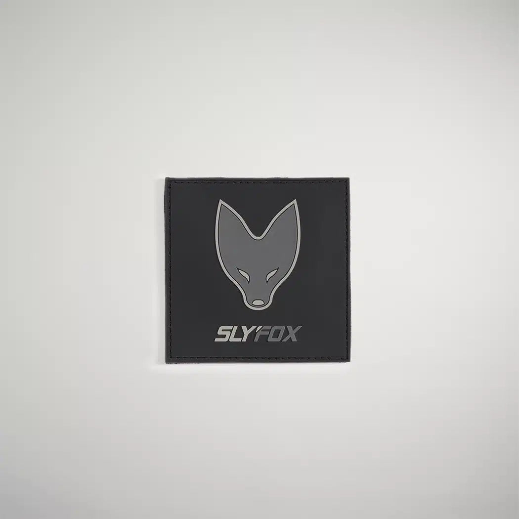 A sleek black wallet featuring a minimalist gray fox logo and the text SLYFOX underneath