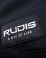 A close-up view of a black clothing label featuring the brand name RUDIS and the phrase A WAY OF LIFE