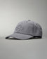 A gray baseball cap with a curved brim and adjustable strap features an embroidered honeycomb design on the front.