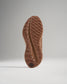 The image showcases the intricate tread design of a brown athletic shoes sole emphasizing its grip and durability