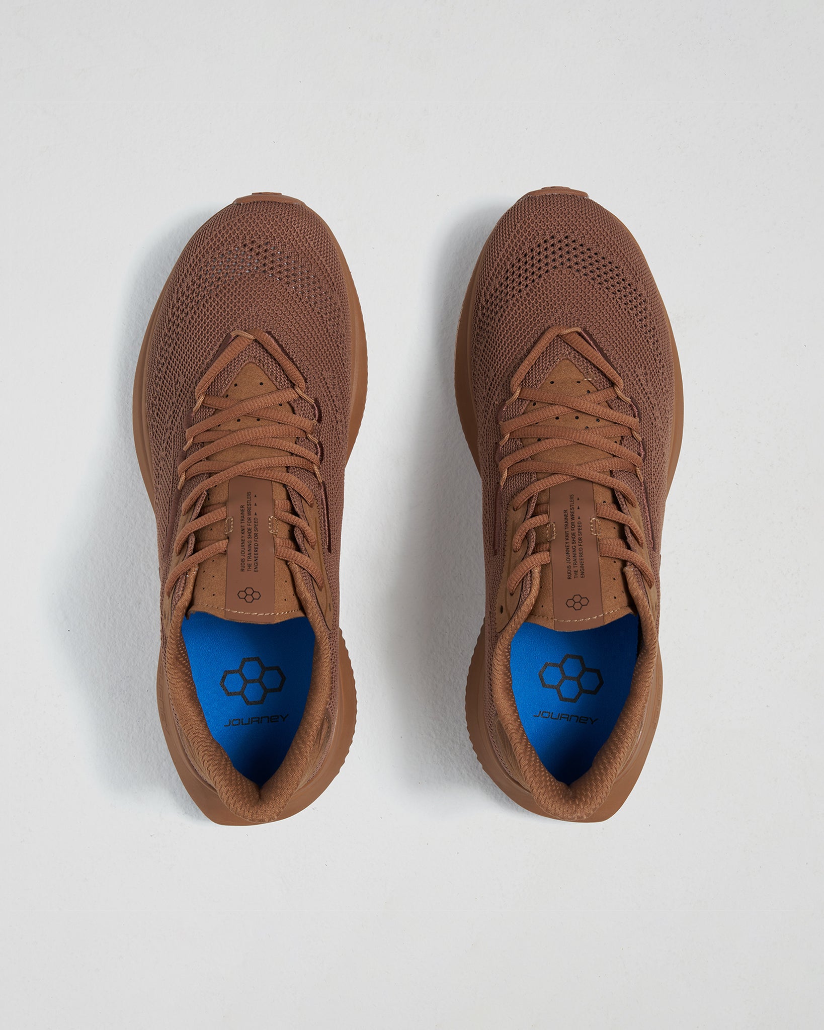 A pair of sleek brown athletic shoes featuring a breathable mesh upper and a vibrant blue insole designed for optimal comfort and support during physical activities