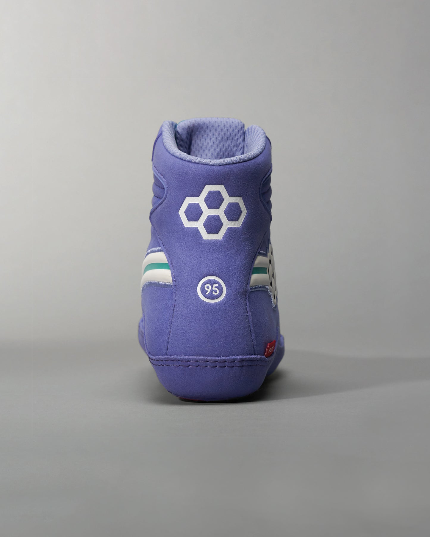 A stylish purple high-top sneaker featuring white and teal stripes and notable branding elements on the back