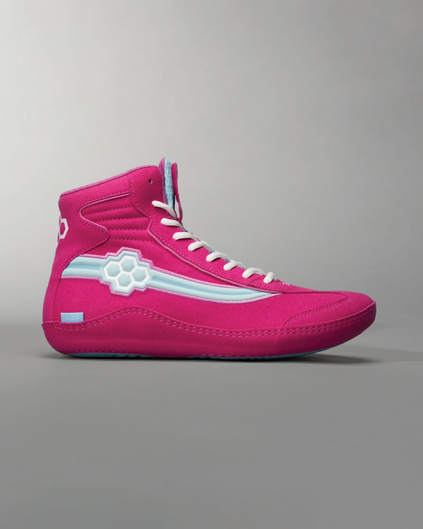 These vibrant pink high-top sneakers feature unique design elements and a stylish silhouette ideal for making a bold fashion statement