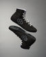 High-top shoes in black with white laces and a striking gray hexagonal design on the sides, combining style with function.