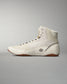 High-top athletic shoe featuring an off-white color, textured materials, and a brown rubber sole, designed for comfort and traction.