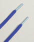 Two blue shoelaces with durable ends resting on a light background