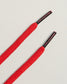 A pair of vibrant red shoelaces with sleek black aglets showcasing a modern design