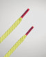 A vibrant yellow shoe lace with black perforations and red aglets featuring the brand RUDIS