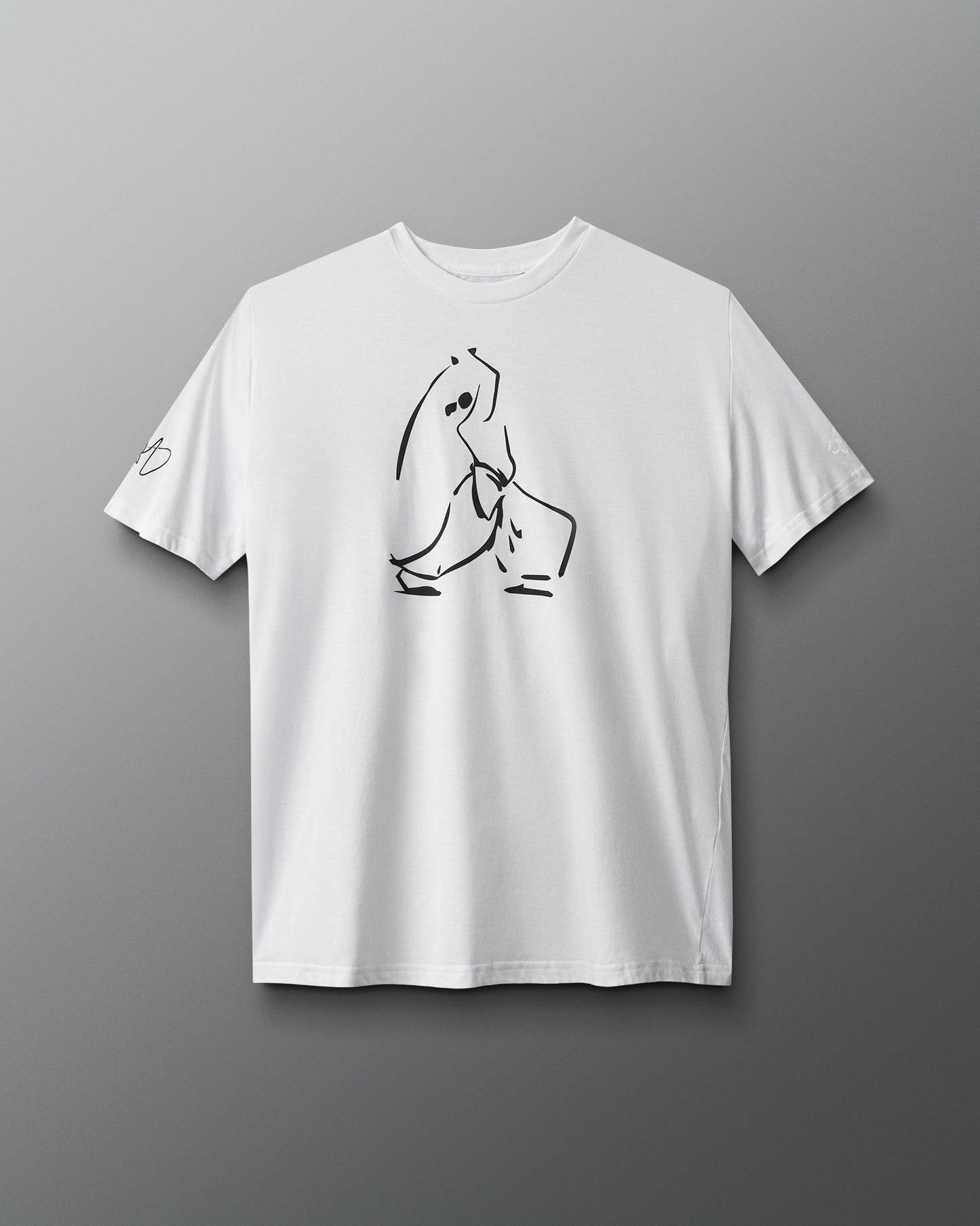 A white t-shirt features a minimalist black line drawing of a sitting figure, complemented by a small graphic on the left sleeve against a gray background.