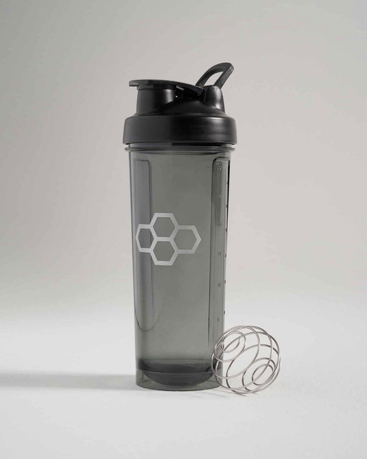 A stylish black shaker bottle with a sleek design featuring a transparent body and a metallic mixing ball beside it