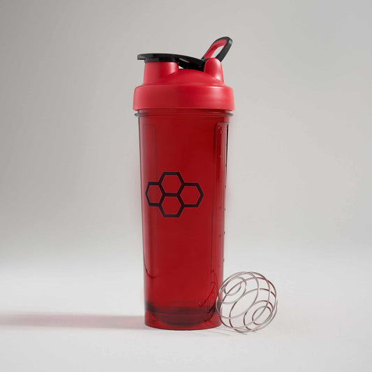 A vibrant red shaker bottle designed for mixing drinks equipped with a black lid and a wire whisk ball for optimal blending