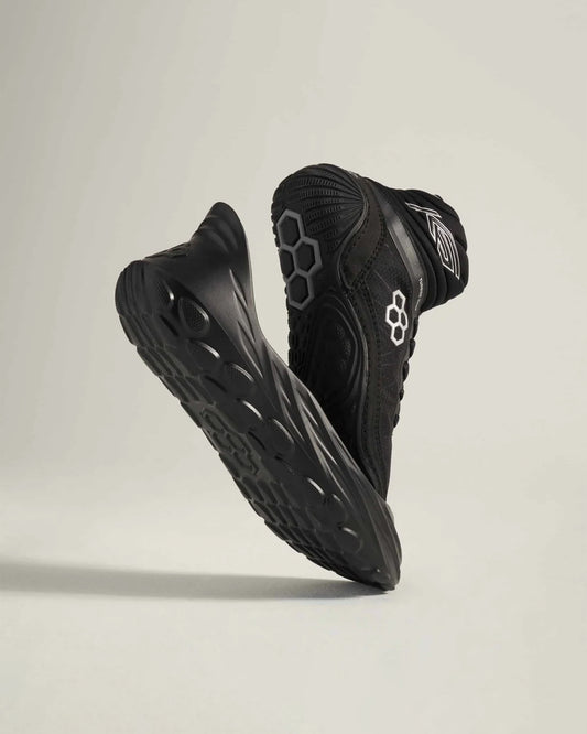 A pair of modern black running shoes featuring a sleek design and unique sole pattern ideal for athletic performance