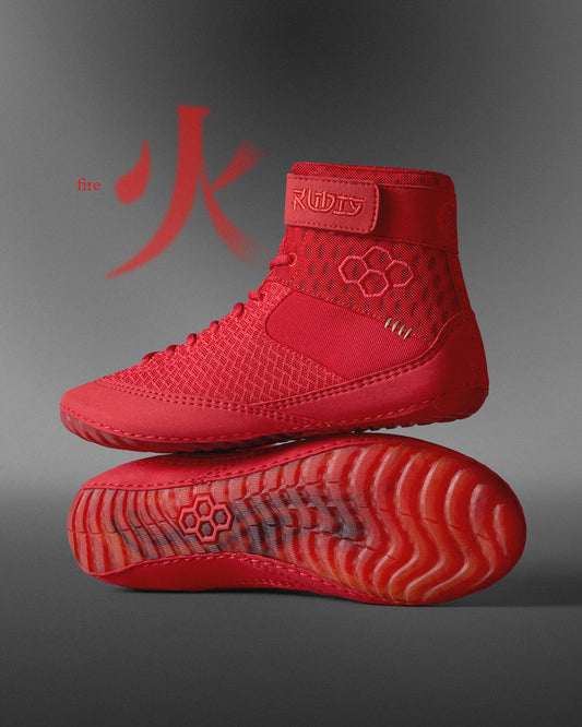 A striking red athletic shoe combines high-top support with a hexagonal traction design, complemented by the text 'fire' against a gradient gray background to emphasize its dynamic style.