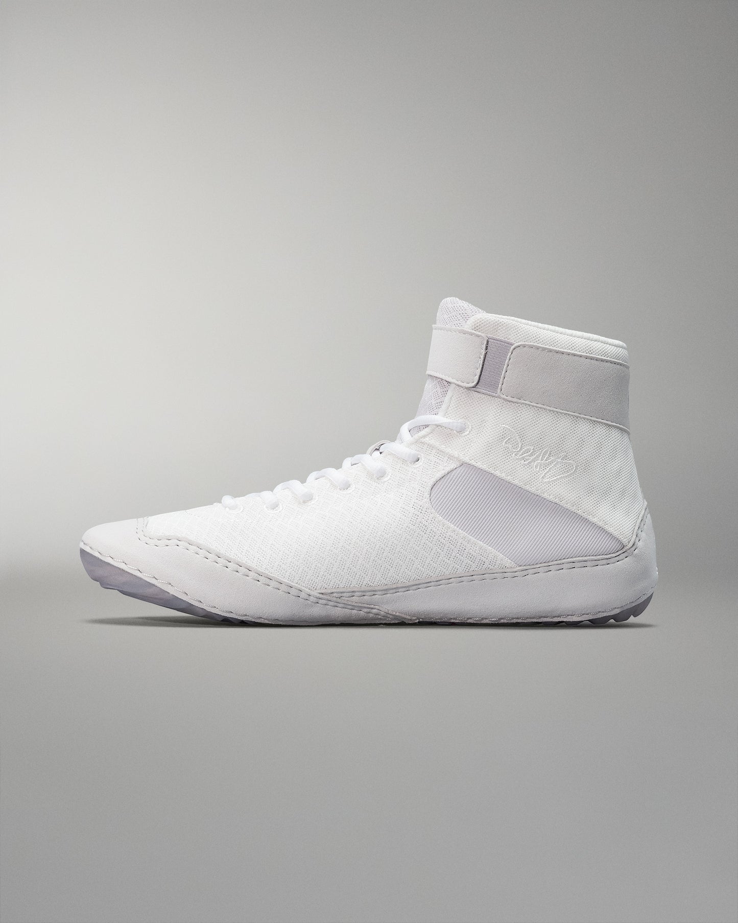 A white high-top athletic shoe with a breathable mesh upper and padded collar for support against a neutral background.