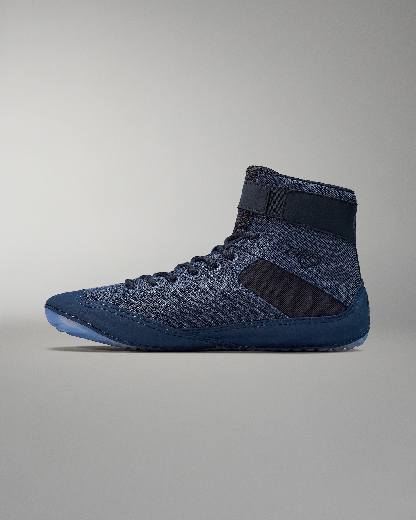 High-top athletic shoe in dark blue with a supportive padded collar, breathable mesh material, and rubber sole for traction against a soft gray background.