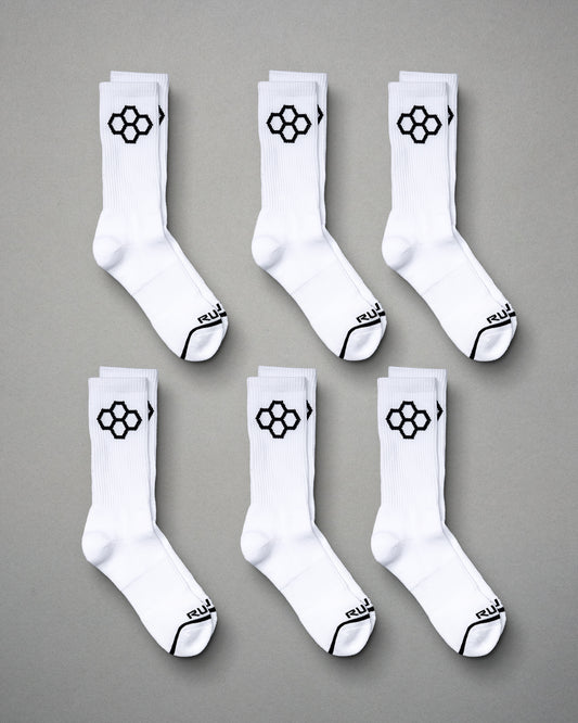 This image displays six pairs of white sports socks featuring a distinctive black hexagonal logo on the sides and black accents on the toes