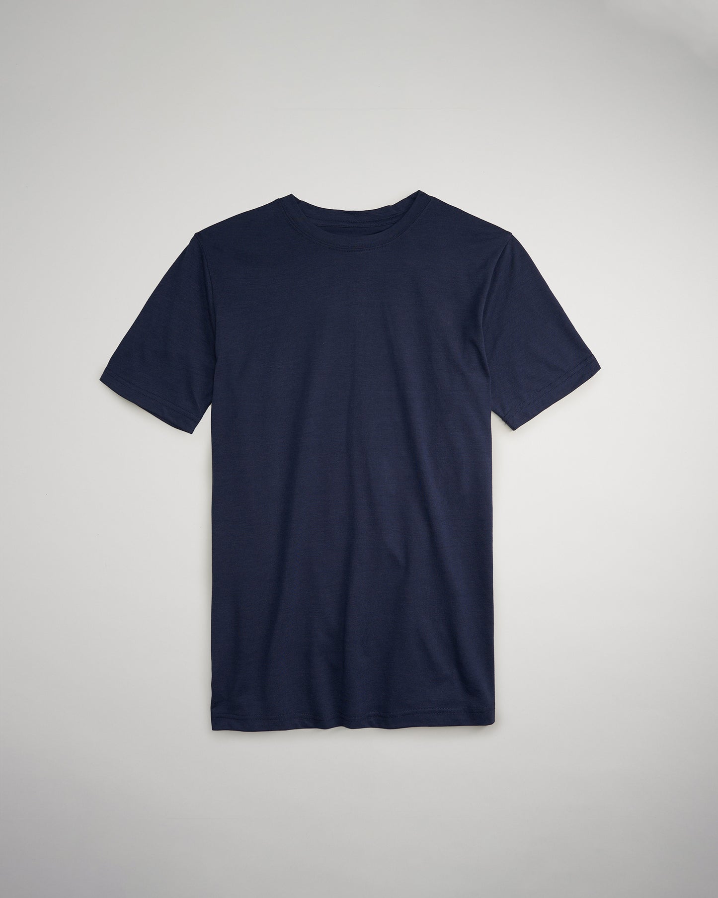 A simple navy blue short-sleeve t-shirt laid flat against a light gray background showcasing its classic design and comfortable fabric