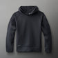 A black athletic hoodie with a spacious hood and raglan sleeves, featuring 'COOL-FEEL' branding, expresses a modern design for comfort and performance.