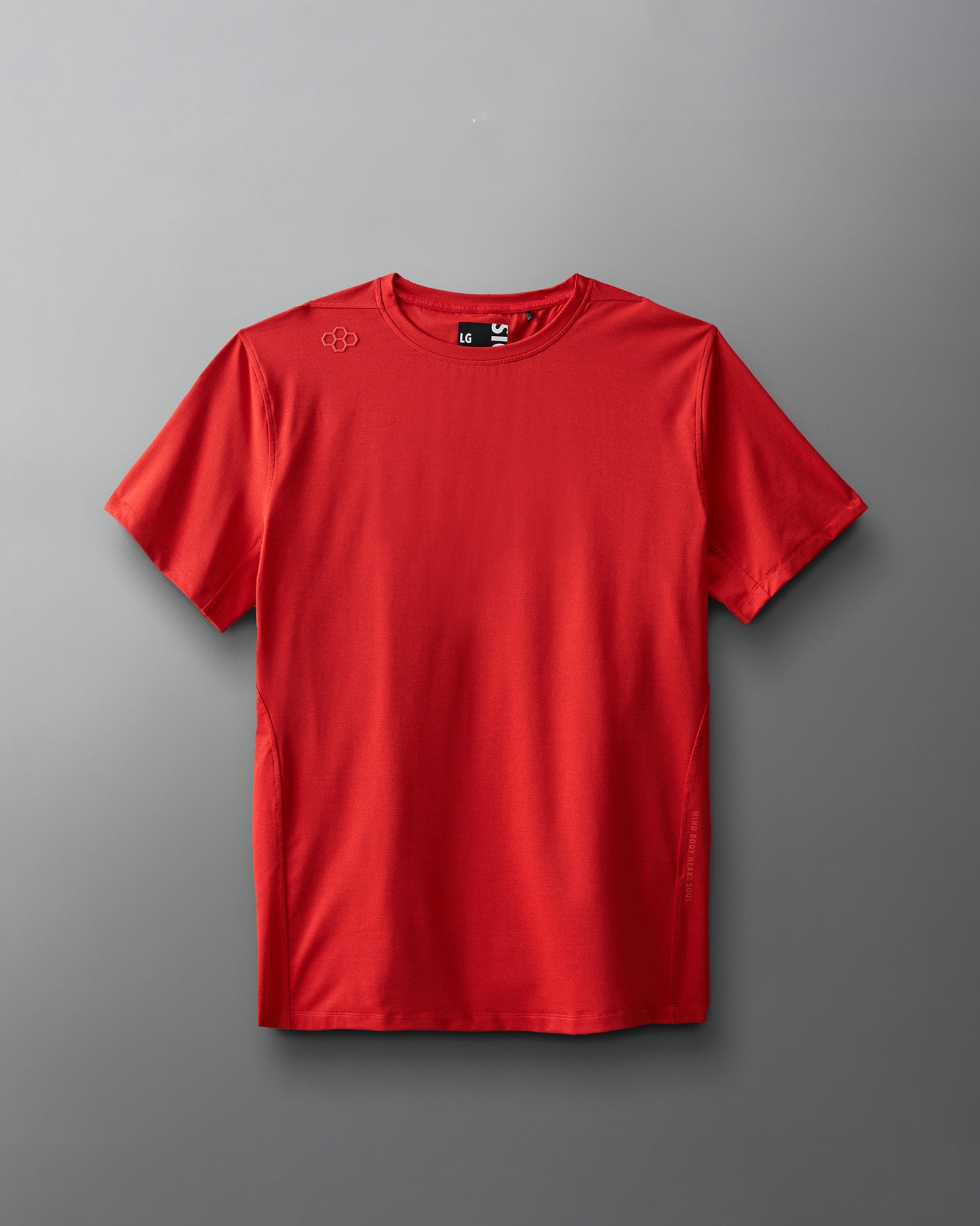 A vibrant red athletic t-shirt with a smooth, lightweight fabric and a minimalist design, featuring an embossed logo on the shoulder.