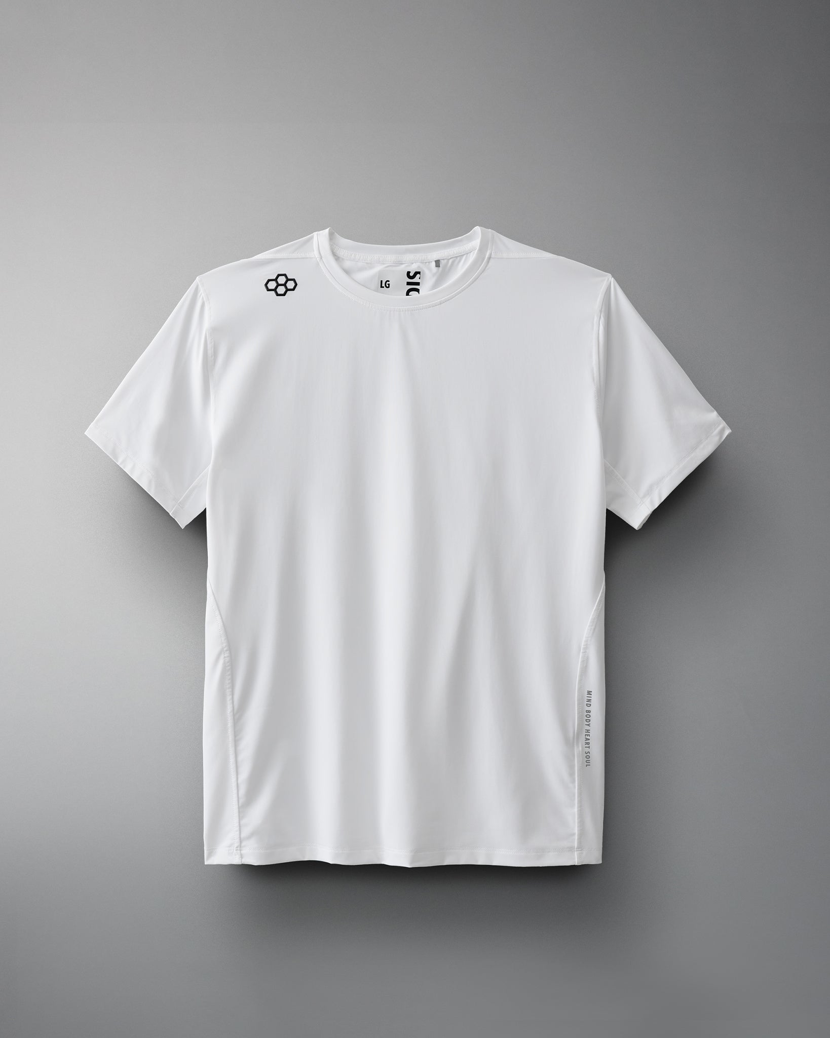 A white short-sleeve athletic shirt with a logo on the shoulder and a side tag, designed for sports and active wear against a soft gray background.