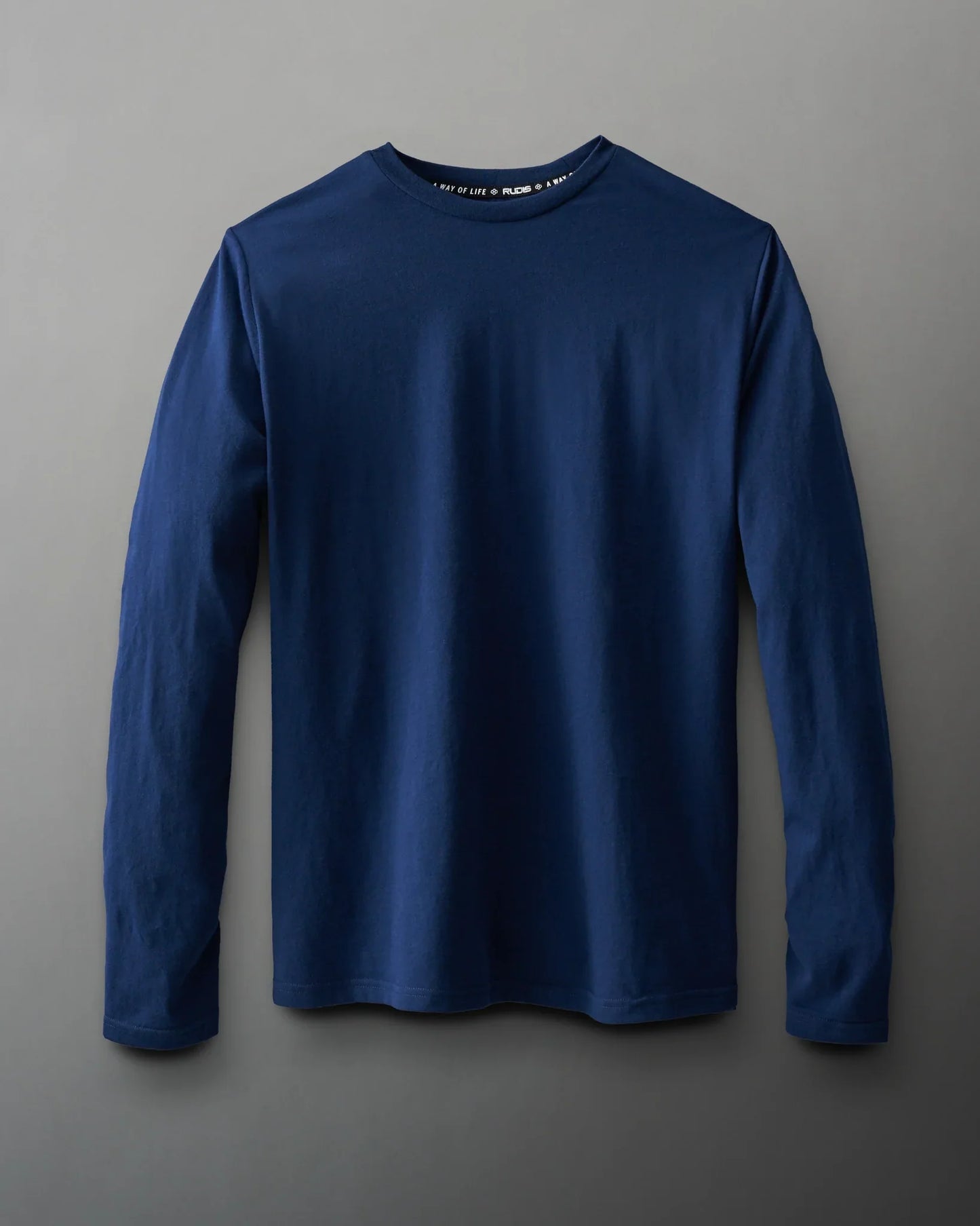 A navy long-sleeve t-shirt displayed flat against a gray background, featuring a classic round neckline and soft texture, ideal for versatile layering.